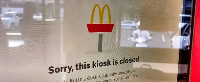 What caused a global pause in McDonald’s services in March 2024?